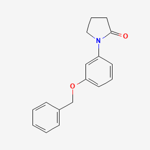 molecular formula C17H17NO2 B15337261 1-[3-(Benzyloxy)phenyl]-2-pyrrolidinone 