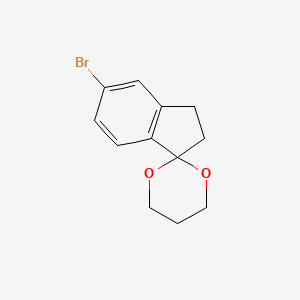 molecular formula C12H13BrO2 B15347221 5-Bromo-1,1-(propylenedioxo)-indane 