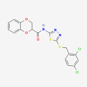 molecular formula C18H13Cl2N3O3S2 B15351197 N-{5-[(2,4-dichlorobenzyl)sulfanyl]-1,3,4-thiadiazol-2-yl}-2,3-dihydro-1,4-benzodioxine-2-carboxamide 