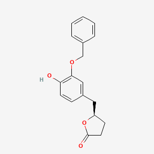 molecular formula C18H18O4 B15352719 (R)-5-(3-(Benzyloxy)-4-hydroxybenzyl)dihydrofuran-2(3H)-one 