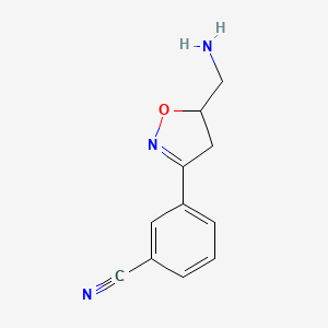 molecular formula C11H11N3O B15357057 3-[5-(Aminomethyl)-4,5-dihydro-1,2-oxazol-3-yl]benzonitrile 