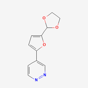 4-[5-(1,3-Dioxolan-2-yl)furan-2-yl]pyridazine