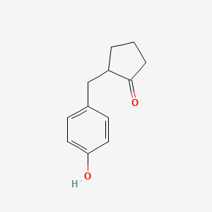 molecular formula C12H14O2 B15378453 2-[(4-Hydroxyphenyl)methyl]cyclopentan-1-one CAS No. 84715-32-2