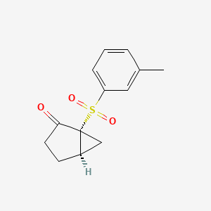 (1R,5R)-1-(3-Methylbenzene-1-sulfonyl)bicyclo[3.1.0]hexan-2-one