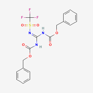 molecular formula C18H16F3N3O6S B1598953 benzyl N-[N-phenylmethoxycarbonyl-N'-(trifluoromethylsulfonyl)carbamimidoyl]carbamate CAS No. 207857-19-0