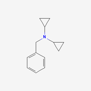 molecular formula C13H17N B1600389 N-Benzyl-N-cyclopropylcyclopropanamine CAS No. 246257-67-0