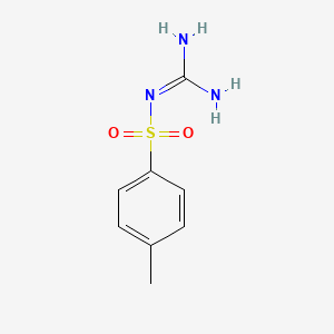 molecular formula C8H12N3O2S+ B1609533 N-[amino(imino)methyl]-4-methylbenzenesulfonamide CAS No. 6584-12-9