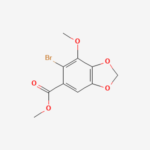molecular formula C10H9BrO5 B1610317 Methyl 6-bromo-7-methoxy-1,3-benzodioxole-5-carboxylate CAS No. 81474-47-7