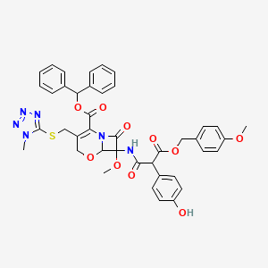 B1626601 Benzhydryl 7-((2-(4-hydroxyphenyl)-3-(4-methoxybenzyloxy)-3-oxopropionyl)amino)-7-methoxy-3-(((1-methyl-1H-tetrazol-5-yl)thio)methyl)-8-oxo-5-oxa-1-azabicyclo(4.2.0)oct-2-ene-2-carboxylate CAS No. 70653-54-2