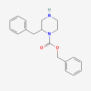 molecular formula C19H22N2O2 B1628869 Benzyl 2-benzylpiperazine-1-carboxylate CAS No. 481038-64-6