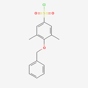 molecular formula C15H15ClO3S B1628953 4-(Benzyloxy)-3,5-dimethylbenzene-1-sulfonyl chloride CAS No. 1016516-29-2