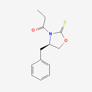 molecular formula C13H15NO2S B1634257 1-[(4R)-4-benzyl-2-sulfanylidene-1,3-oxazolidin-3-yl]propan-1-one 