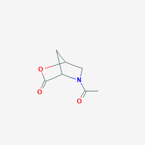 molecular formula C7H9NO3 B1637894 (3R,6R)-4-Acetyl-3,6-methanomorpholine-2-one 