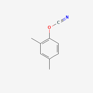 molecular formula C9H9NO B1642295 Cyanic acid 2,4-dimethylphenyl ester 