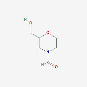 molecular formula C6H11NO3 B1644745 2-(Hydroxymethyl)morpholine-4-carbaldehyde 