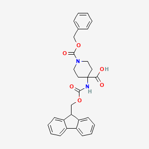 molecular formula C29H28N2O6 B1647876 4-(9H-Fluoren-9-ylmethoxycarbonylamino)-piperidine-1,4-dicarboxylic acid monobenzyl ester 