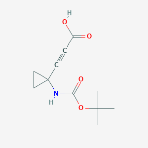 molecular formula C11H15NO4 B1651474 3-[1-[(2-Methylpropan-2-yl)oxycarbonylamino]cyclopropyl]prop-2-ynoic acid CAS No. 1268810-10-1