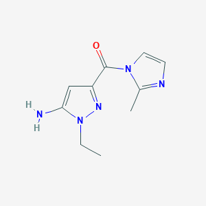 molecular formula C10H13N5O B1653500 1-ethyl-3-[(2-methyl-1H-imidazol-1-yl)carbonyl]-1H-pyrazol-5-amine CAS No. 1856019-38-9
