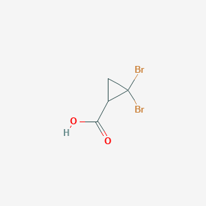 molecular formula C4H4Br2O2 B1656666 Ácido 2,2-dibromociclopropanocarboxílico CAS No. 5365-17-3