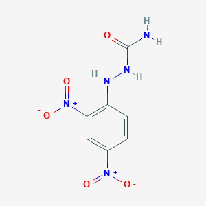 molecular formula C7H7N5O5 B1660305 2-(2,4-Dinitrophenyl)hydrazine-1-carboxamide CAS No. 74367-79-6