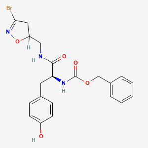 B1673372 benzyl N-[(2S)-1-[(3-bromo-4,5-dihydro-1,2-oxazol-5-yl)methylamino]-3-(4-hydroxyphenyl)-1-oxopropan-2-yl]carbamate CAS No. 744198-19-4