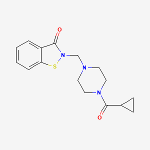 B1674999 2-[[4-(Cyclopropanecarbonyl)piperazin-1-yl]methyl]-1,2-benzothiazol-3-one CAS No. 877963-94-5
