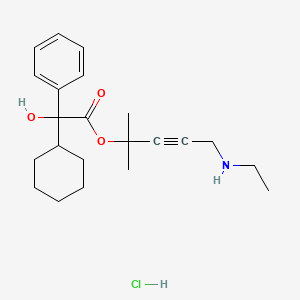 B1679232 Benzeneacetic acid, alpha-cyclohexyl-alpha-hydroxy-, 4-(ethylamino)-1,1-dimethyl-2-butynyl ester, hydrochloride CAS No. 129927-37-3
