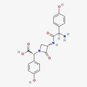 molecular formula C19H19N3O6 B1679384 (2R)-2-[(3S)-3-[[2-amino-2-(4-hydroxyphenyl)acetyl]amino]-2-oxoazetidin-1-yl]-2-(4-hydroxyphenyl)acetic acid CAS No. 65309-11-7