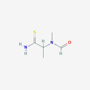 molecular formula C5H10N2OS B170803 N-(1-amino-1-sulfanylidenepropan-2-yl)-N-methylformamide CAS No. 199278-27-8