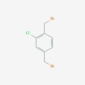 molecular formula C8H7Br2Cl B172299 1,4-Bis(bromomethyl)-2-chlorobenzene CAS No. 10221-09-7