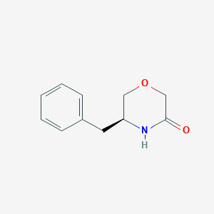 molecular formula C11H13NO2 B180806 (5S)-5-benzylmorpholin-3-one CAS No. 101250-48-0