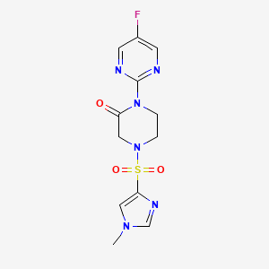 molecular formula C12H13FN6O3S B2353955 1-(5-Fluoropyrimidin-2-yl)-4-(1-methylimidazol-4-yl)sulfonylpiperazin-2-one CAS No. 2320925-29-7