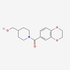 molecular formula C15H19NO4 B2357547 (2,3-Dihydrobenzo[b][1,4]dioxin-6-yl)(4-(hydroxymethyl)piperidin-1-yl)methanone CAS No. 1179187-11-1