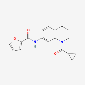 molecular formula C18H18N2O3 B2358679 N-[1-(环丙烷甲酰)-3,4-二氢-2H-喹啉-7-基]呋喃-2-甲酰胺 CAS No. 898439-27-5