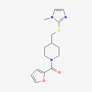 molecular formula C15H19N3O2S B2360556 furan-2-yl(4-(((1-methyl-1H-imidazol-2-yl)thio)methyl)piperidin-1-yl)methanone CAS No. 1428378-31-7