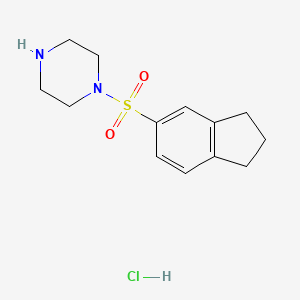molecular formula C13H19ClN2O2S B2365379 1-((2,3-Dihydro-1H-inden-5-yl)sulfonyl)piperazine hydrochloride CAS No. 1580413-73-5