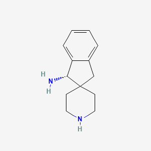 (1S)-spiro[1,3-dihydroindene-2,4'-piperidine]-1-amine