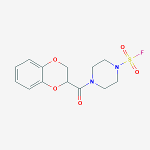 molecular formula C13H15FN2O5S B2373853 4-(2,3-Dihydro-1,4-benzodioxine-3-carbonyl)piperazine-1-sulfonyl fluoride CAS No. 2411201-43-7