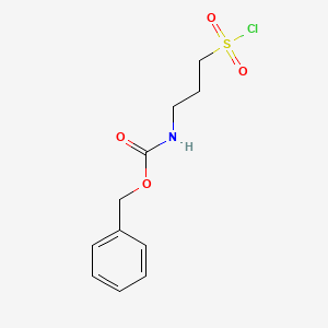 molecular formula C11H14ClNO4S B2375592 (3-Chlorosulfonyl-propyl)-carbamic acid benzyl ester CAS No. 1196157-57-9