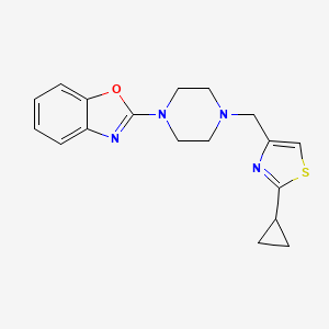 molecular formula C18H20N4OS B2381057 2-[4-[(2-Cyclopropyl-1,3-thiazol-4-yl)methyl]piperazin-1-yl]-1,3-benzoxazole CAS No. 2415488-12-7