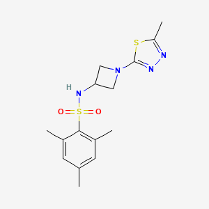 molecular formula C15H20N4O2S2 B2381740 2,4,6-Trimethyl-N-[1-(5-methyl-1,3,4-thiadiazol-2-yl)azetidin-3-yl]benzenesulfonamide CAS No. 2415521-17-2