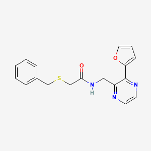 2-(benzylthio)-N-((3-(furan-2-yl)pyrazin-2-yl)methyl)acetamide