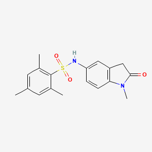 molecular formula C18H20N2O3S B2388670 2,4,6-三甲基-N-(1-甲基-2-氧代吲哚啉-5-基)苯磺酰胺 CAS No. 921861-88-3