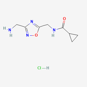 molecular formula C8H13ClN4O2 B2389701 N-{[3-(Aminomethyl)-1,2,4-oxadiazol-5-YL]methyl}cyclopropanecarboxamide hydrochloride CAS No. 1706460-57-2