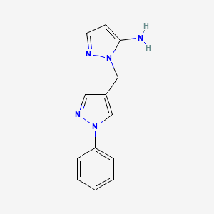 molecular formula C13H13N5 B2393381 1-[(1-Phenyl-1H-pyrazol-4-YL)methyl]-1H-pyrazol-5-amine CAS No. 1052554-89-8