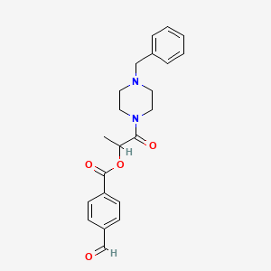 [1-(4-Benzylpiperazin-1-yl)-1-oxopropan-2-yl] 4-formylbenzoate