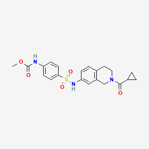 molecular formula C21H23N3O5S B2397606 4-(N-(2-环丙烷羰基)-1,2,3,4-四氢异喹啉-7-基)磺酰基)苯基甲基氨基甲酸甲酯 CAS No. 1448054-16-7