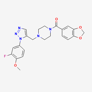 molecular formula C22H22FN5O4 B2403292 1-(1,3-benzodioxol-5-ylcarbonyl)-4-{[1-(3-fluoro-4-methoxyphenyl)-1H-1,2,3-triazol-5-yl]methyl}piperazine CAS No. 1421585-81-0