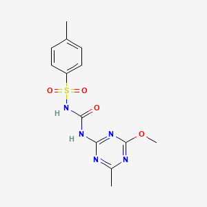 molecular formula C13H15N5O4S B2404614 2-Methoxy-4-methyl-6-[({[(4-methylphenyl)sulfonyl]amino}carbonyl)amino]-1,3,5-triazine CAS No. 125069-22-9