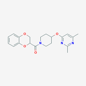 molecular formula C20H23N3O4 B2405990 (2,3-Dihydrobenzo[b][1,4]dioxin-2-yl)(4-((2,6-dimethylpyrimidin-4-yl)oxy)piperidin-1-yl)methanone CAS No. 2034558-25-1